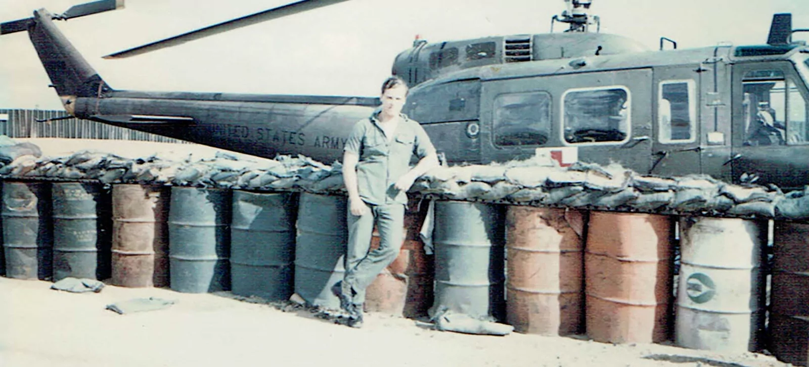 James Hunter in Vietnam in 1970, standing beside a US Army helicopter